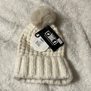 NWT super soft creme Pom hat perfect with any jacket.